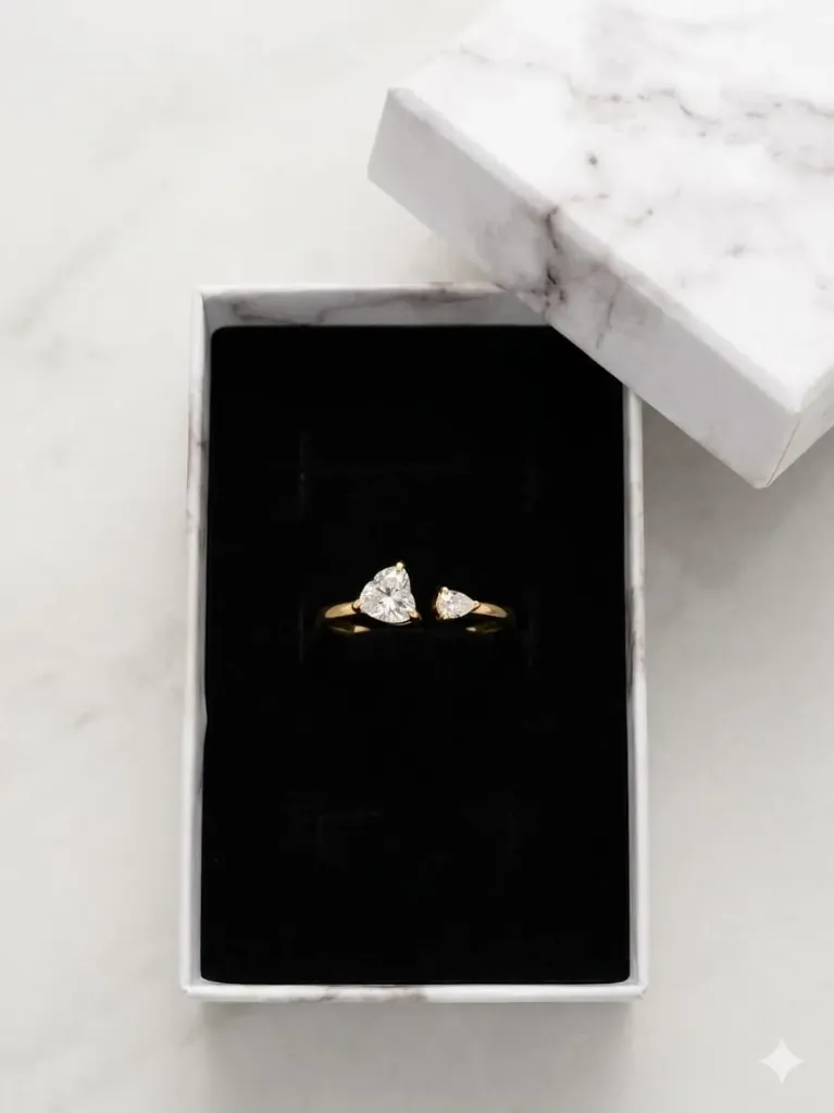 Elegant Gold Open-Band Ring with Dual Pear‑Cut Sparkling Stones